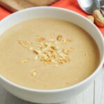 peanut soup in white bowl