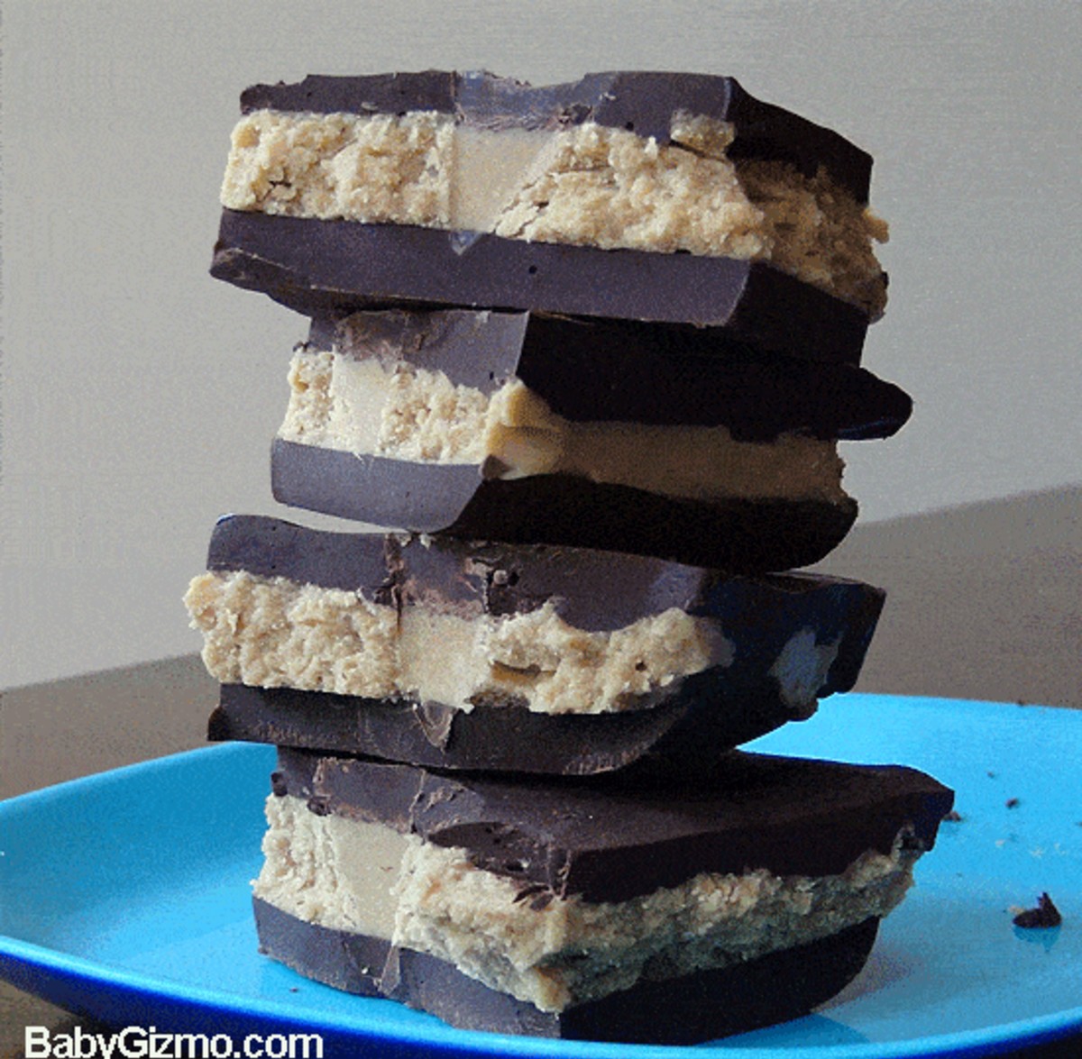 Peanut butter cup bark stacked on a blue plate