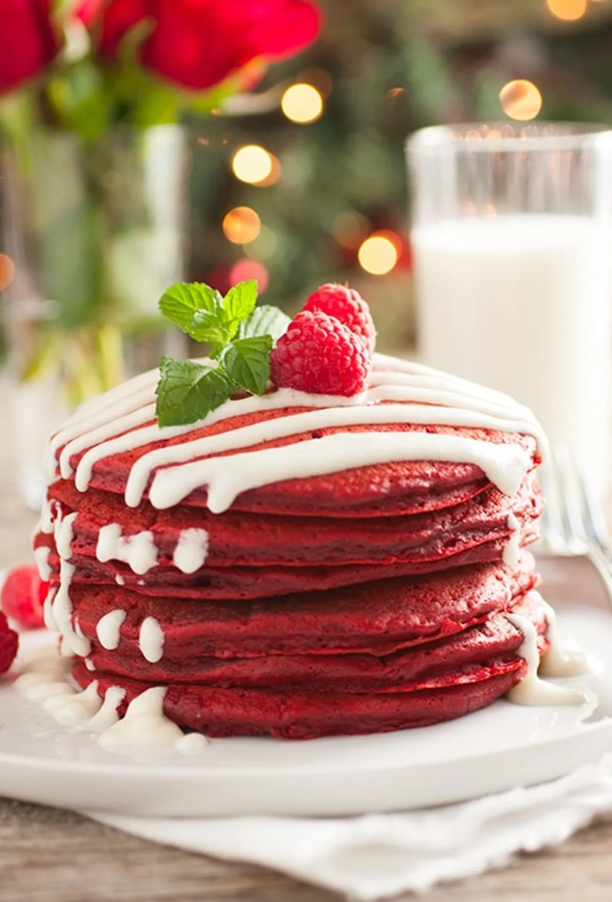 red velvet pancakes stacked on a plate