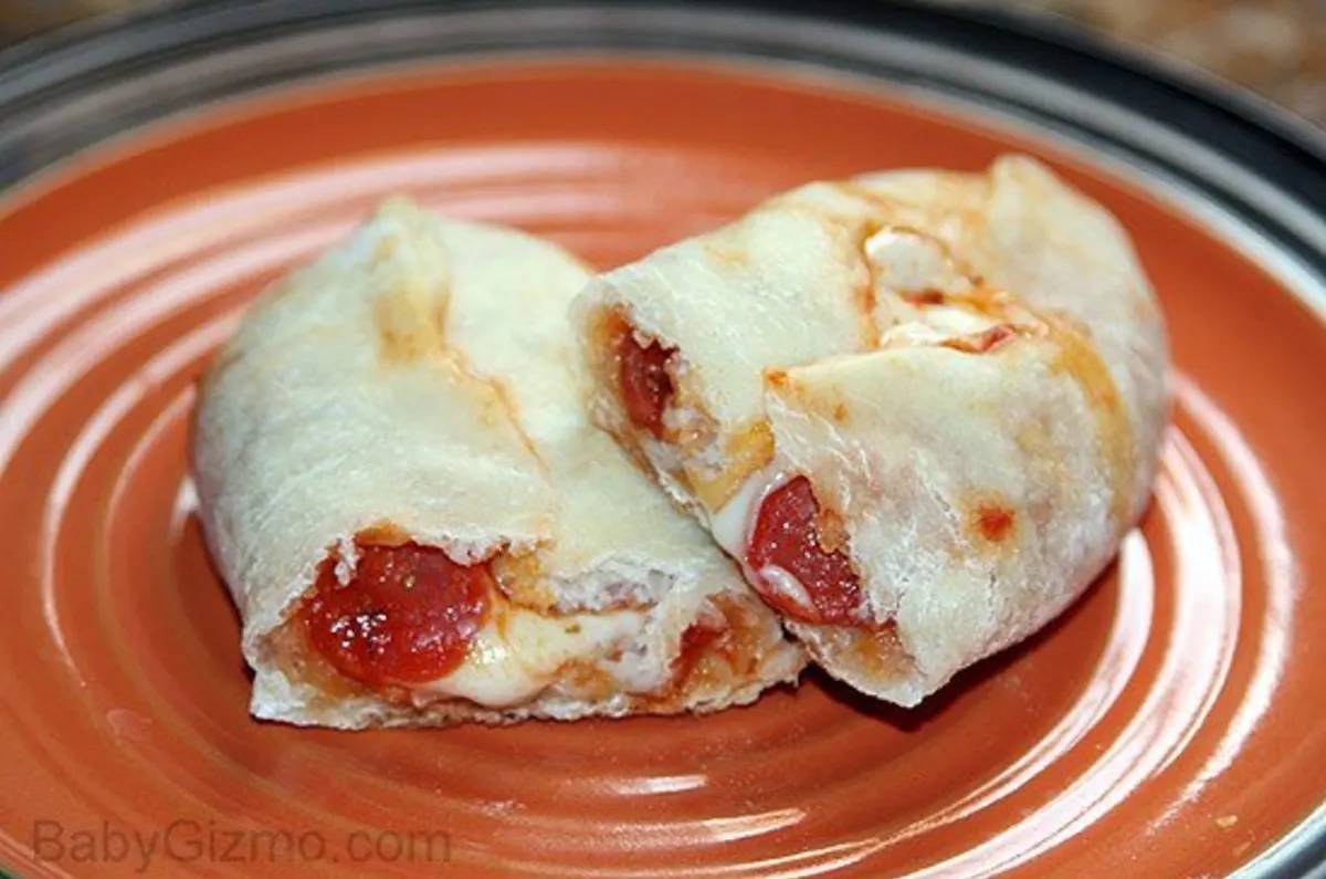 Pizza rolls on an orange plate 