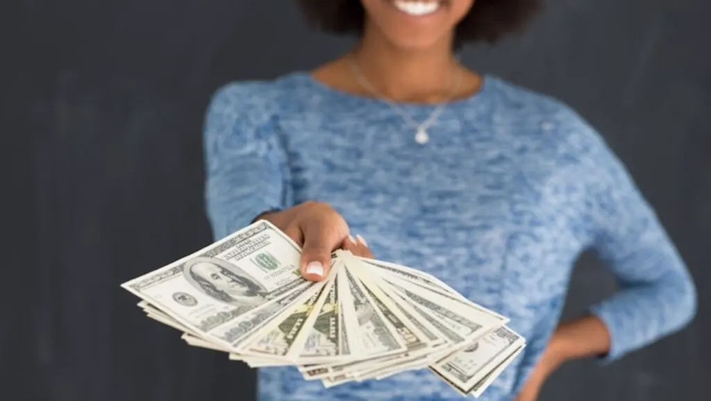 woman holding money