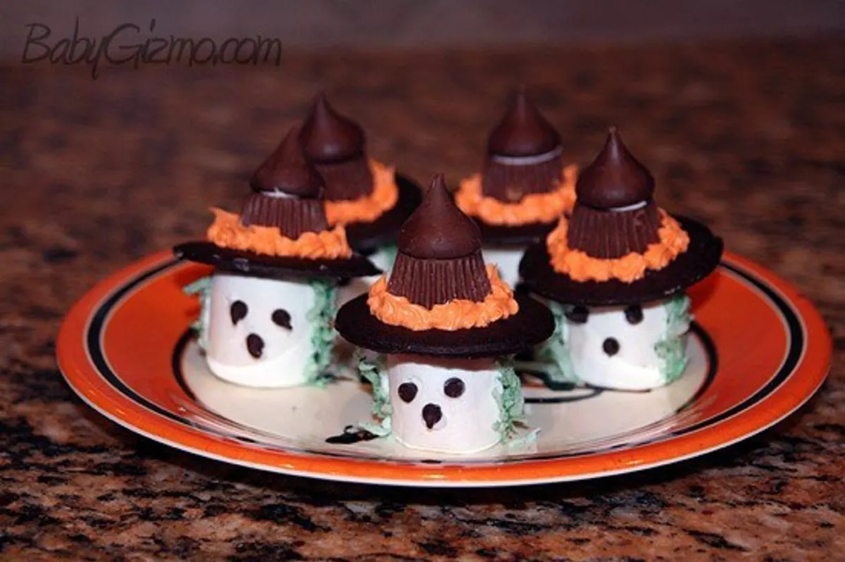 Marshmallow Witches on a orange plate 