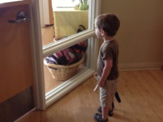 preschooler looking in window