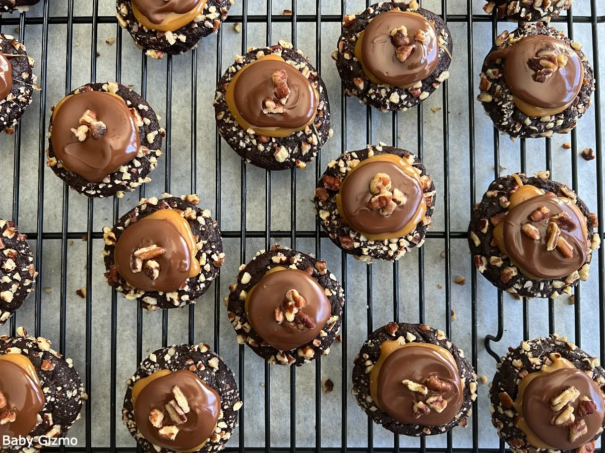 Crumbl Turtle Cookies on cooling rack