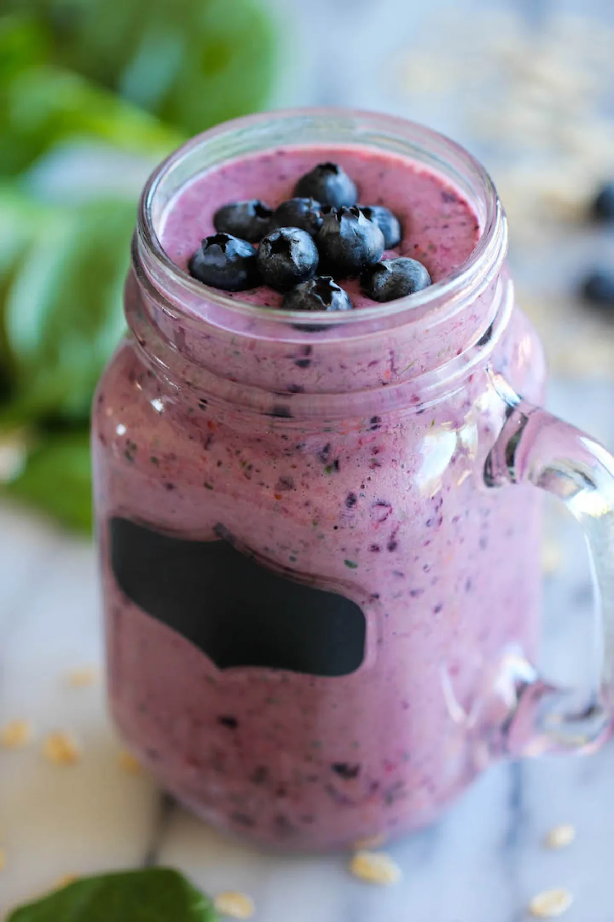 berry green smoothie in a jar